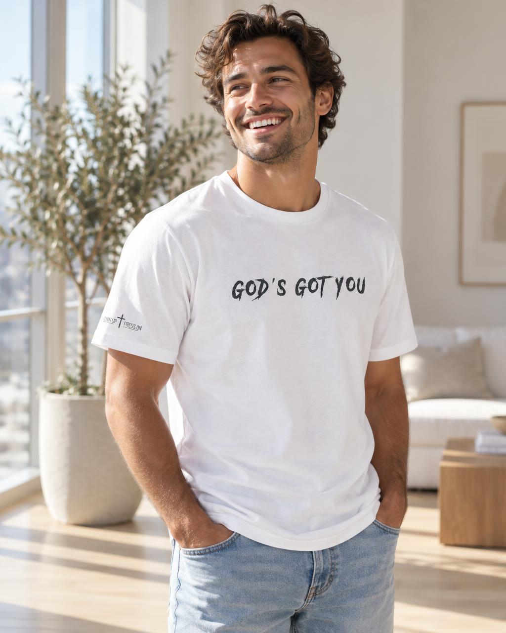 Young man wearing a white GOD'S GOT YOU Unisex t-shirt with the sleeve logo visible.